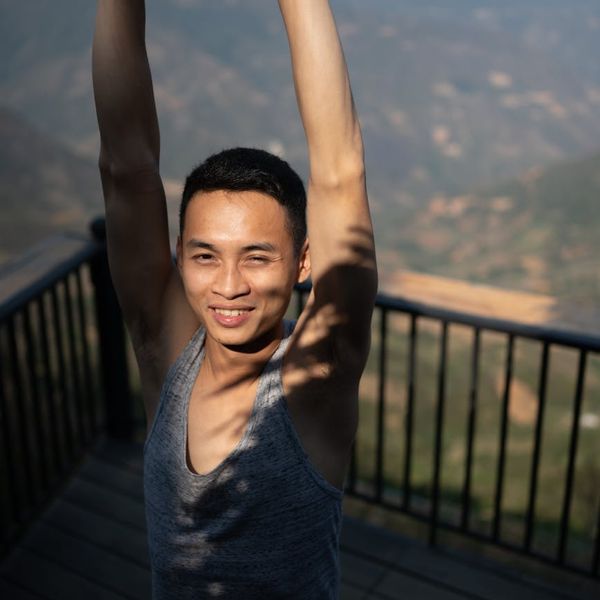 Person stretching gently outdoors, feeling energized and free.